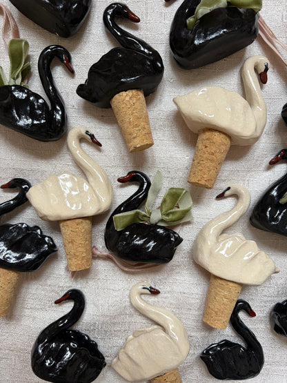 Hand sculpted ceramic swan bottle stoppers and ornamental hanging swan ornaments
